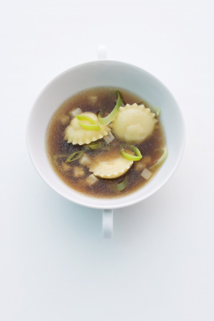 Duck stock with truffle and onion ravioli