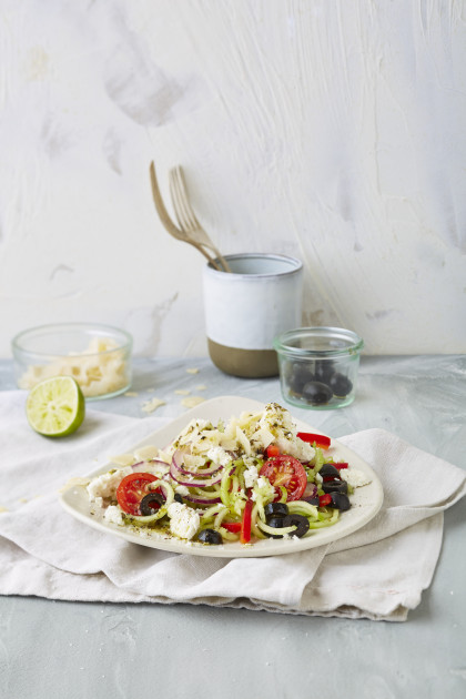 Greek veggie noodle salad with feta cheese, tomatoes and olives