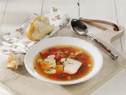 Clear tomato soup with chicken fillet