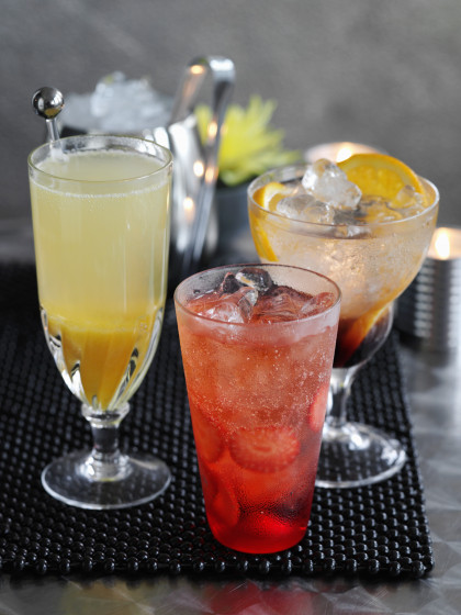 Lemon and orange fizz with cassis, a peach bellini and a shirley temple with strawberries (cocktails)