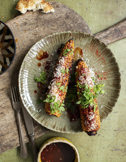 Smokey grilled corn on the cob with BBQ sauce
