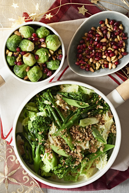 Brussels sprouts, savoy cabbage and broccoli with pomegranate seeds and nuts for Christmas