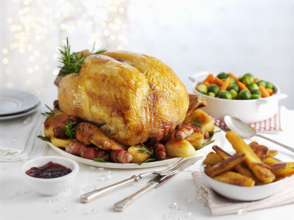 Traditional roast turkey with roast potatoes, carrots and sprouts for Christmas