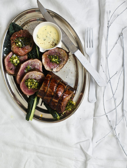 Beef fillet, filled with kale, almonds, feta cheese and Parmesan cheese, with parsley sauce for Christmas