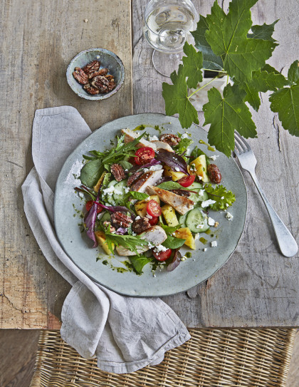 Colourful summer salad with grilled pineapple, chicken breast and feta cheese