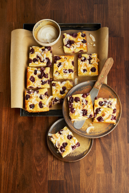 Gluten-free yogurt and coconut slices with morello cherries