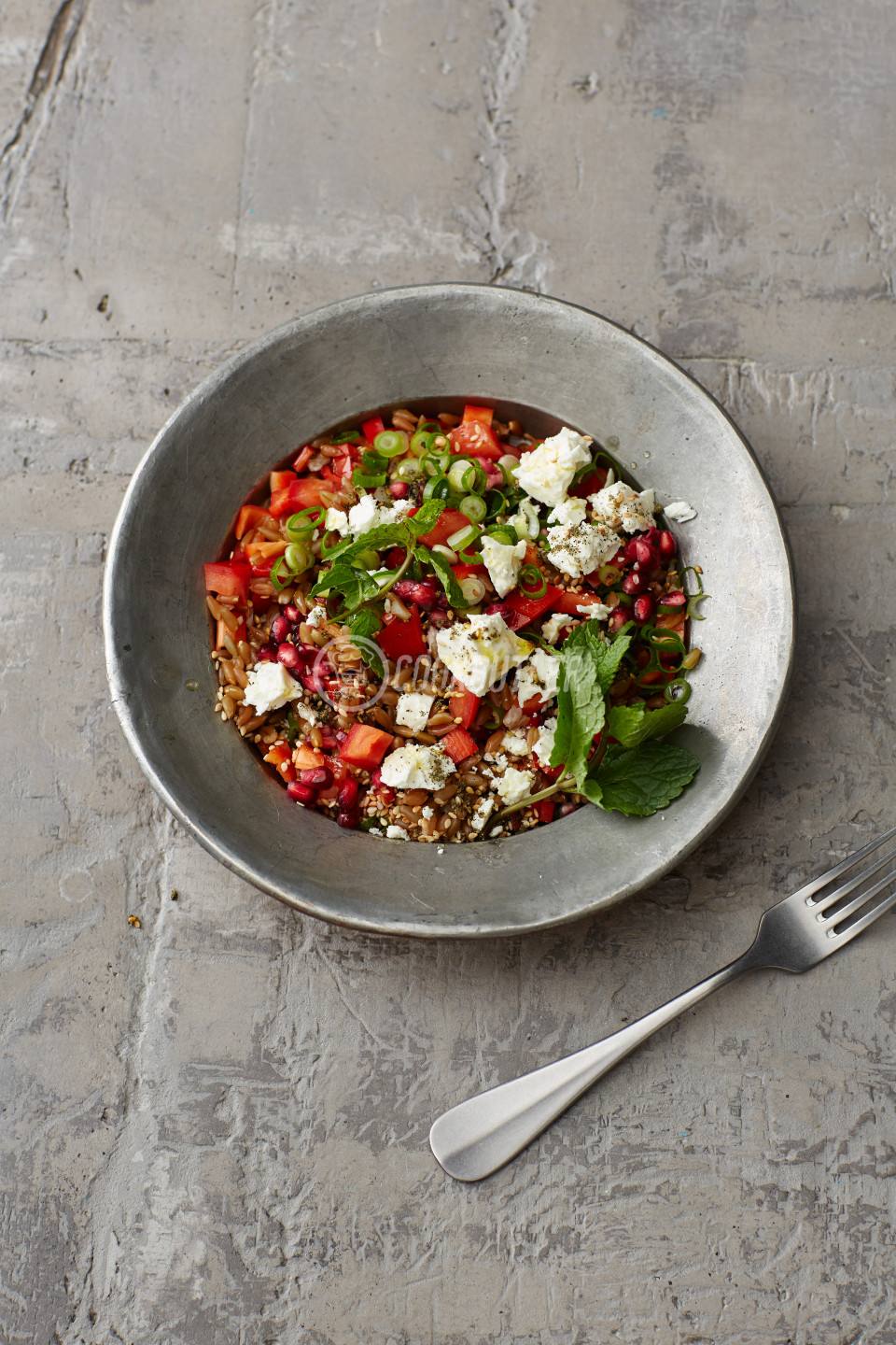 Freekeh salad with pomegranate seeds and feta cheese | preview