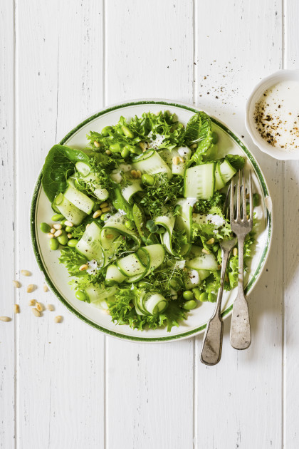 Healthy green salad with edamame and pine nuts